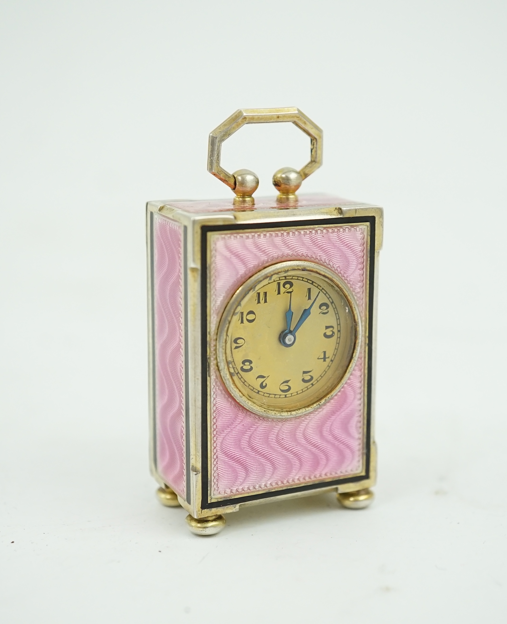 An early 20th century Swiss silver gilt and two colour enamel miniature carriage timepiece